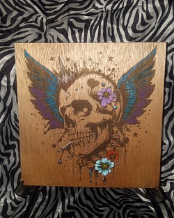 Hand painted and laser engraved punk art skull with wings