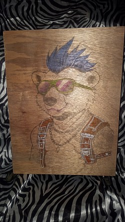 Punk rocker bear in overalls laser engraving on wood
